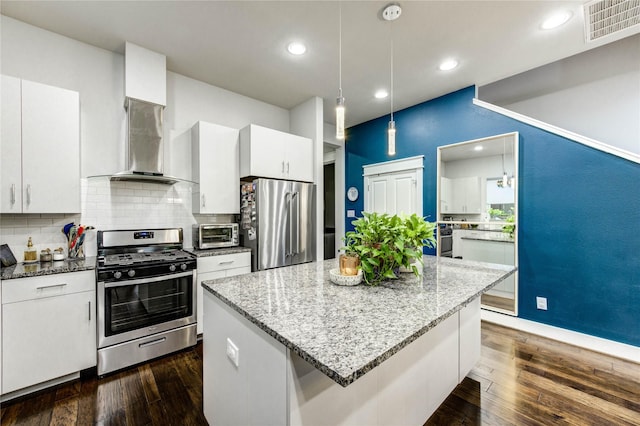 2013 Schweikhardt St, Houston, TX 77020 - kitchen with stainless steel appliances, white cabinetry, backsplash, light stone countertops, and recessed lighting