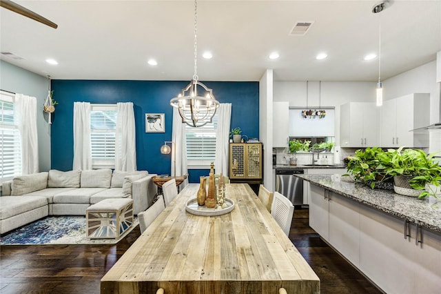 2013 Schweikhardt St, Houston, TX 77020 - dining room with a chandelier, dark wood-style flooring, and recessed lighting