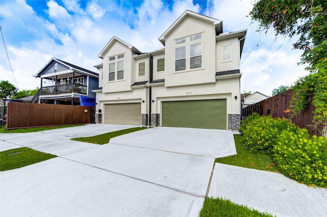 2013 Schweikhardt St, Houston, TX 77020 - view of front facade with an attached garage, stone siding, stucco siding, and concrete driveway
