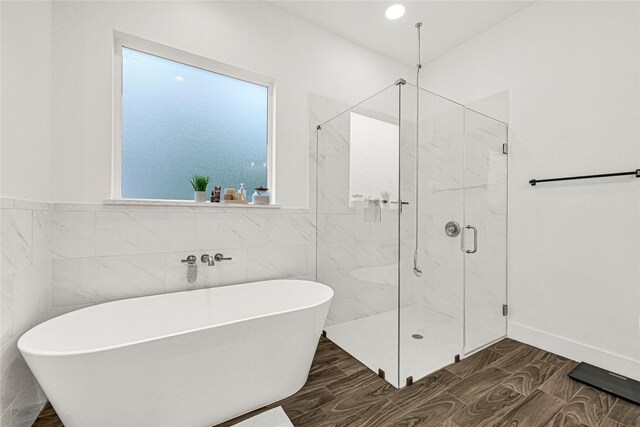 960 Rd 6609, Dayton, TX 77535 - bathroom with a freestanding bath, a stall shower, and tile walls