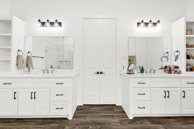 960 Rd 6609, Dayton, TX 77535 - full bath featuring a marble finish shower, two vanities, and a closet