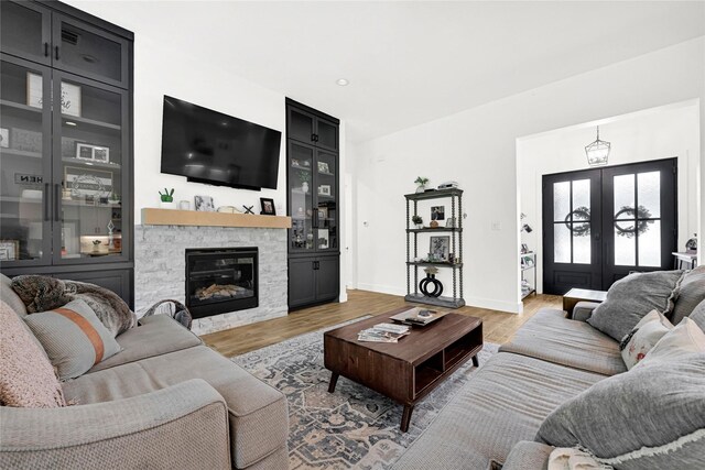 960 Rd 6609, Dayton, TX 77535 - living area with wood finished floors, french doors, and a fireplace