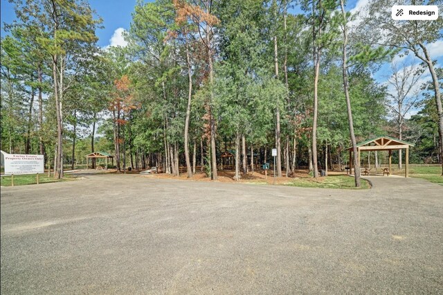 960 Rd 6609, Dayton, TX 77535 - view of yard with a gazebo and view of wooded area