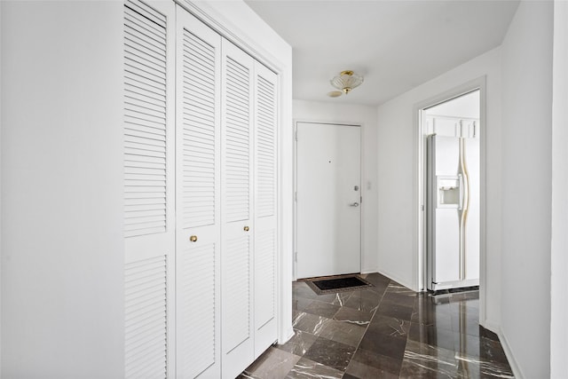 1111 Bering Dr Unit 805, Houston, TX 77057 - entryway featuring baseboards and dark marble finish floors