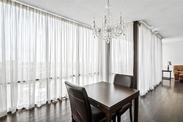 1111 Bering Dr Unit 805, Houston, TX 77057 - dining area featuring a chandelier, dark wood-style floors, and a textured ceiling
