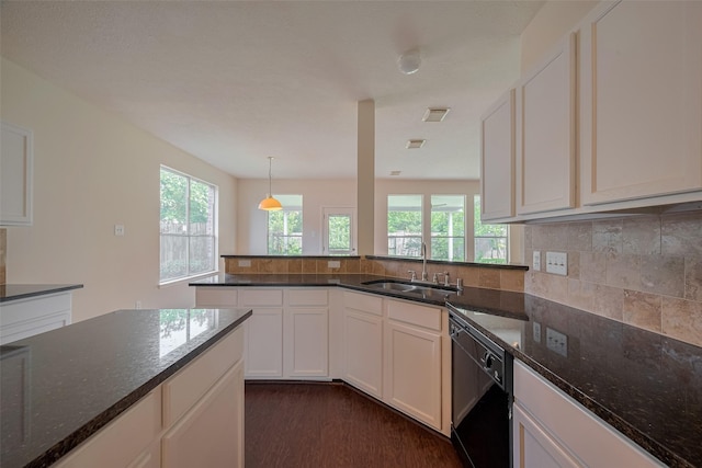 619 Bending Bough Dr, Spring, TX 77388 - kitchen featuring black dishwasher, plenty of natural light, dark stone countertops, and tasteful backsplash