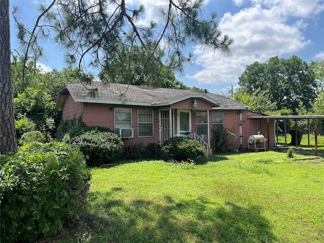 10113 Teneha Dr, Houston, TX 77033 - view of front of property with a front lawn, cooling unit, and a carport