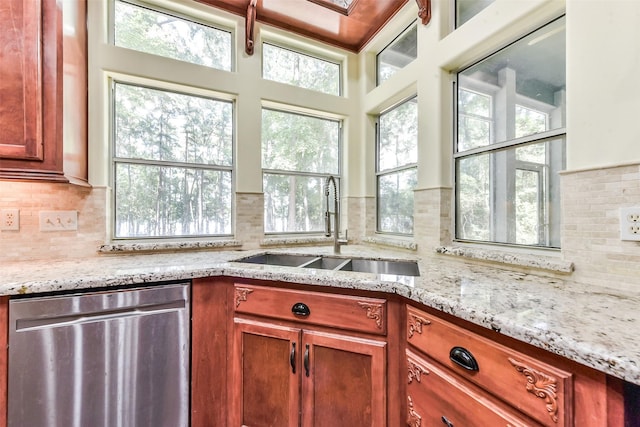 19426 Indigo Lake Dr, Magnolia, TX 77355 - kitchen featuring stainless steel dishwasher, tasteful backsplash, and plenty of natural light