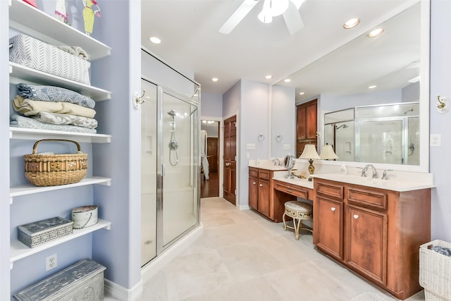 19426 Indigo Lake Dr, Magnolia, TX 77355 - bathroom featuring a stall shower, vanity, a ceiling fan, and recessed lighting