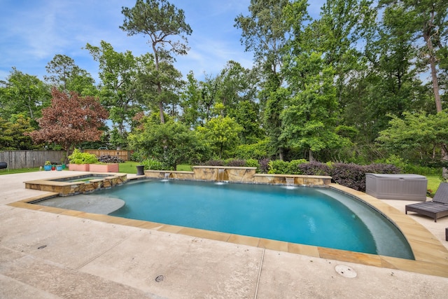 27016 Hidden Grove Landing Dr, Spring, TX 77386 - view of swimming pool with a patio, a pool with connected hot tub, and view of wooded area