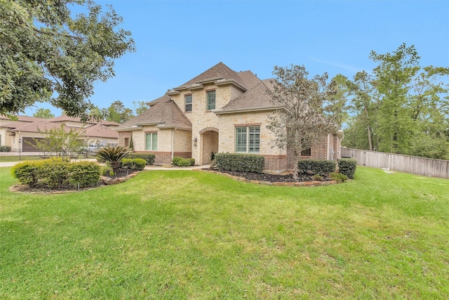 27016 Hidden Grove Landing Dr, Spring, TX 77386 - view of front of home featuring brick siding and roof with shingles