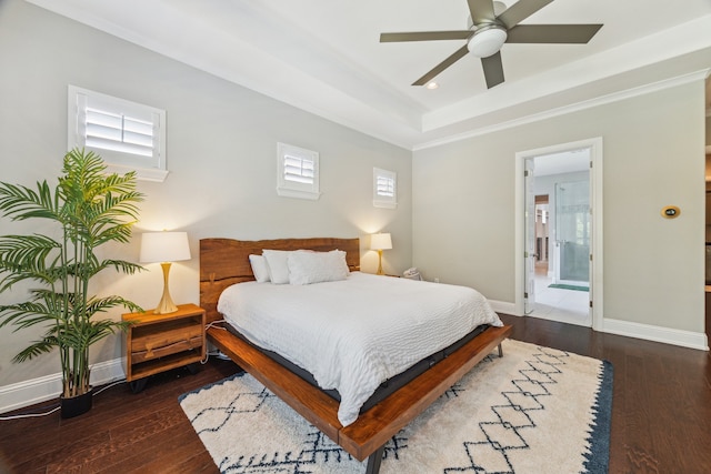 27016 Hidden Grove Landing Dr, Spring, TX 77386 - bedroom featuring hardwood / wood-style floors, multiple windows, and a raised ceiling