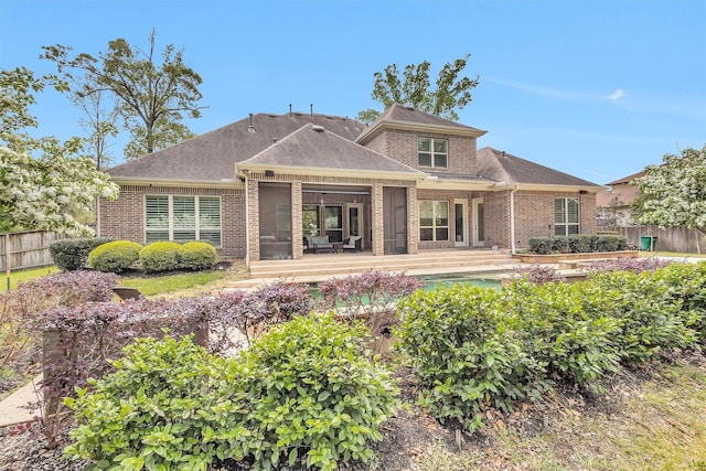 27016 Hidden Grove Landing Dr, Spring, TX 77386 - back of property with brick siding, a wooden deck, and roof with shingles