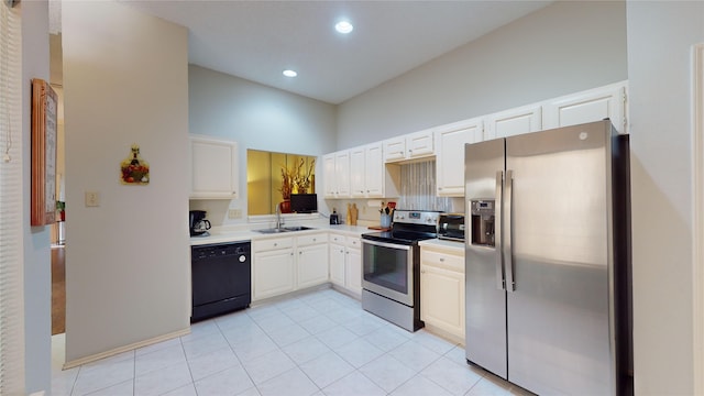 3011 Flower Field Ln, Pearland, TX 77584 - kitchen with stainless steel appliances, white cabinets, light countertops, light tile patterned floors, and recessed lighting