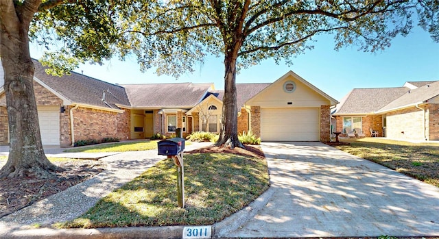 3011 Flower Field Ln, Pearland, TX 77584 - view of front of home featuring brick siding, driveway, and an attached garage