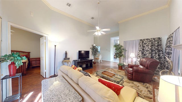 3011 Flower Field Ln, Pearland, TX 77584 - living area featuring wood finished floors, crown molding, a ceiling fan, and a towering ceiling