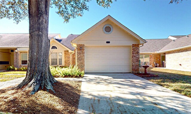 3011 Flower Field Ln, Pearland, TX 77584 - single story home featuring concrete driveway, brick siding, and an attached garage