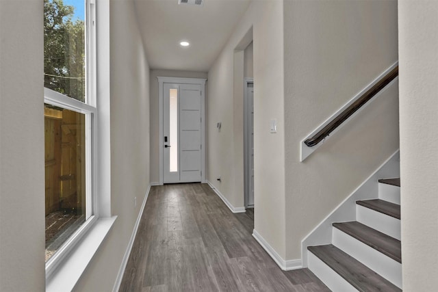 2413 Harlem St, Houston, TX 77020 - entryway with wood finished floors, stairs, and recessed lighting