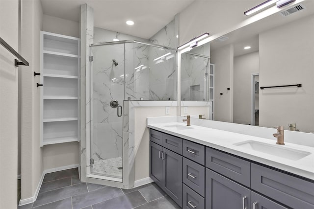 2413 Harlem St, Houston, TX 77020 - full bath with a marble finish shower, double vanity, tile patterned flooring, and recessed lighting