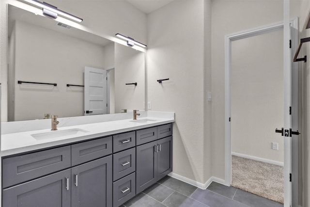 2413 Harlem St, Houston, TX 77020 - bathroom with tile patterned floors and double vanity