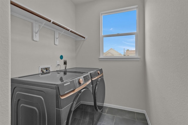 2413 Harlem St, Houston, TX 77020 - laundry area with washer and clothes dryer and dark tile patterned floors