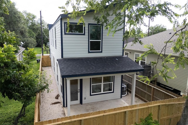 2413 Harlem St, Houston, TX 77020 - back of property with roof with shingles and a patio area
