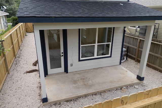 2413 Harlem St, Houston, TX 77020 - rear view of property featuring a shingled roof, a patio, and a fenced backyard