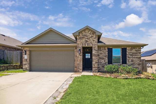 12303 Trumpetfish Ct, Conroe, TX 77304 - view of front of property featuring a garage, concrete driveway, and brick siding