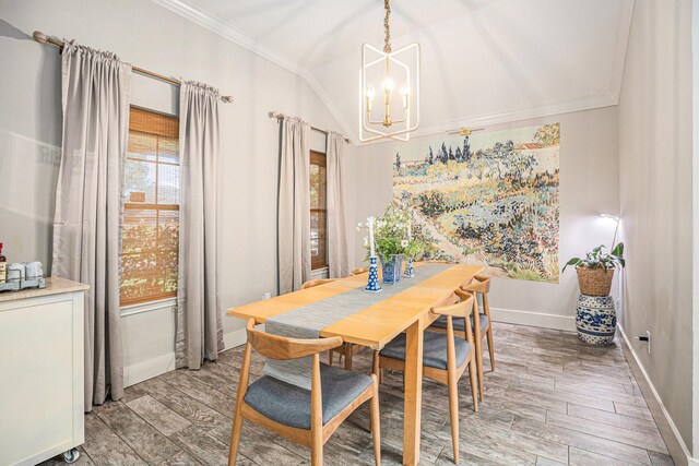 2884 Shallow Brook Ln, League City, TX 77539 - dining area featuring crown molding, a chandelier, light wood-style flooring, healthy amount of natural light, and vaulted ceiling