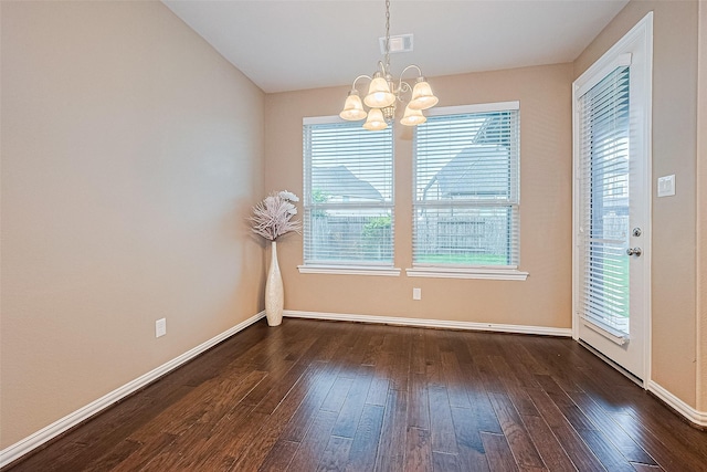 6518 Nicholas Trl, Sugar Land, TX 77479 - unfurnished dining area with a chandelier and dark wood-type flooring