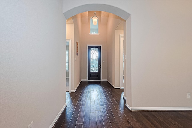 6518 Nicholas Trl, Sugar Land, TX 77479 - entrance foyer featuring dark wood-style floors and arched walkways