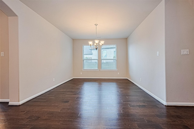6518 Nicholas Trl, Sugar Land, TX 77479 - empty room with a chandelier, dark wood-style flooring, and arched walkways