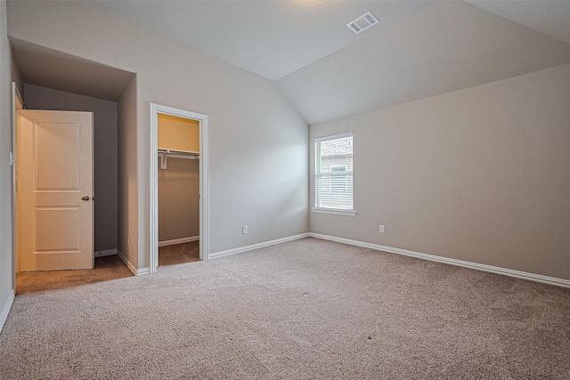 6518 Nicholas Trl, Sugar Land, TX 77479 - unfurnished bedroom featuring lofted ceiling, carpet flooring, and a walk in closet