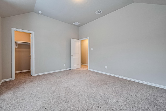 6518 Nicholas Trl, Sugar Land, TX 77479 - unfurnished bedroom featuring lofted ceiling, carpet floors, and a walk in closet