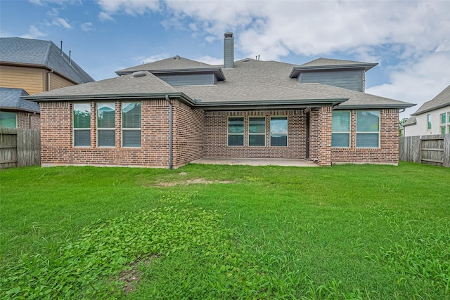 6518 Nicholas Trl, Sugar Land, TX 77479 - rear view of house featuring a patio area, brick siding, a shingled roof, and a chimney