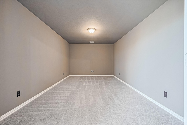 6518 Nicholas Trl, Sugar Land, TX 77479 - carpeted empty room featuring a textured ceiling and baseboards