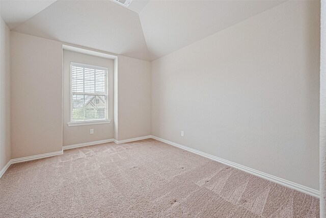 6518 Nicholas Trl, Sugar Land, TX 77479 - spare room with light carpet and vaulted ceiling