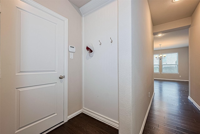 6518 Nicholas Trl, Sugar Land, TX 77479 - hallway featuring a chandelier, dark wood finished floors, and recessed lighting