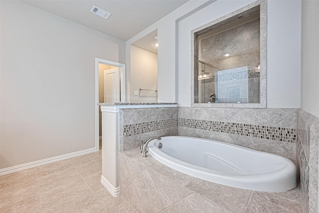 6518 Nicholas Trl, Sugar Land, TX 77479 - bathroom featuring a bath, a tile shower, and tile patterned flooring