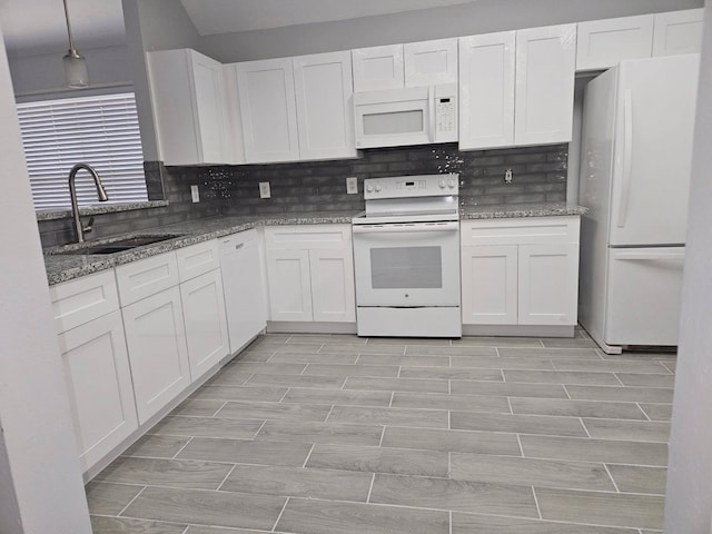 7022 Meadow Hawk Ct, Houston, TX 77041 - kitchen featuring white appliances, white cabinets, decorative backsplash, and light stone countertops
