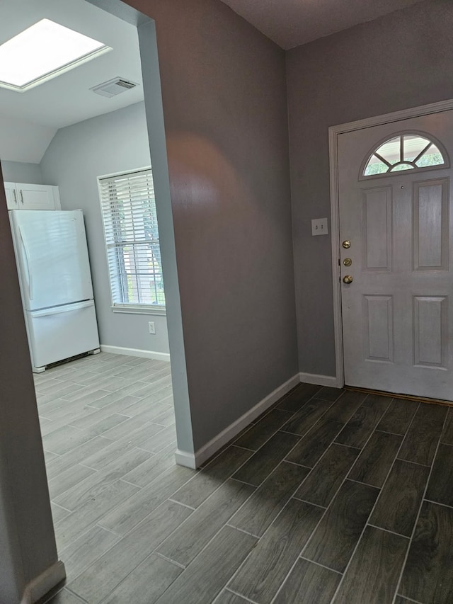 7022 Meadow Hawk Ct, Houston, TX 77041 - entrance foyer with wood finish floors, a skylight, and vaulted ceiling