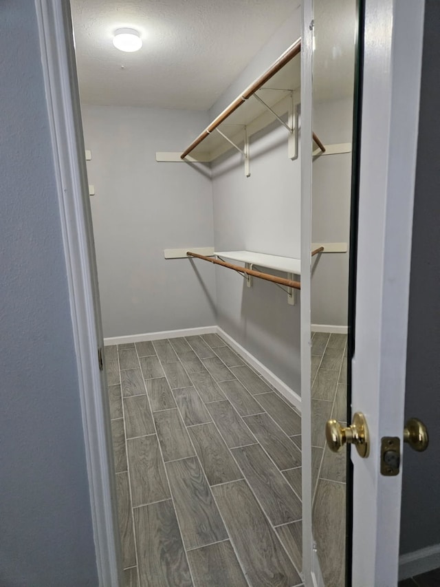 7022 Meadow Hawk Ct, Houston, TX 77041 - walk in closet with wood tiled floors