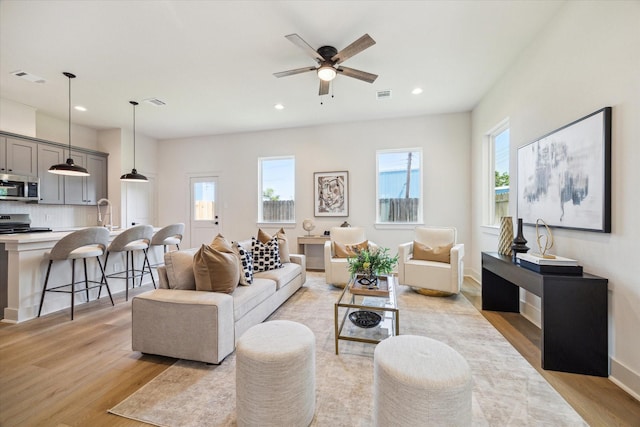 5256 Texas St, Houston, TX 77011 - living area featuring light wood-style flooring, plenty of natural light, recessed lighting, and a ceiling fan