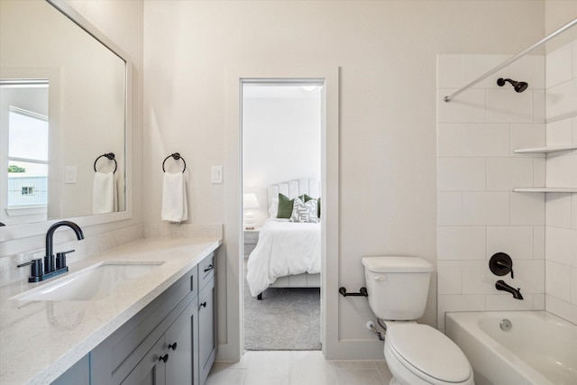 5256 Texas St, Houston, TX 77011 - bathroom featuring vanity, connected bathroom, tub / shower combination, and tile patterned flooring
