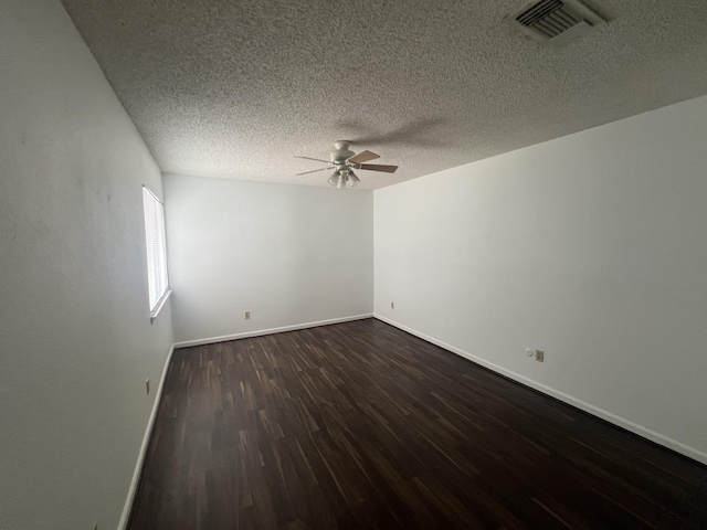 7104 Brendam Ln, Houston, TX 77072 - spare room featuring a ceiling fan, dark wood-style flooring, and a textured ceiling