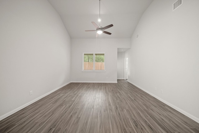 13200 Musky Dr, Conroe, TX 77384 - empty room with ceiling fan, dark wood-style flooring, and high vaulted ceiling