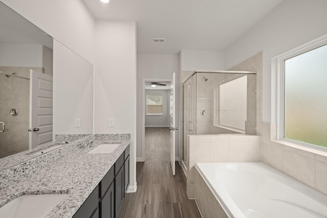 13200 Musky Dr, Conroe, TX 77384 - full bathroom with a shower stall, a bath, double vanity, and healthy amount of natural light