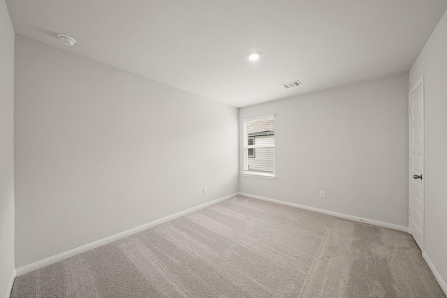 13200 Musky Dr, Conroe, TX 77384 - empty room with light carpet, a smoke detector, and recessed lighting
