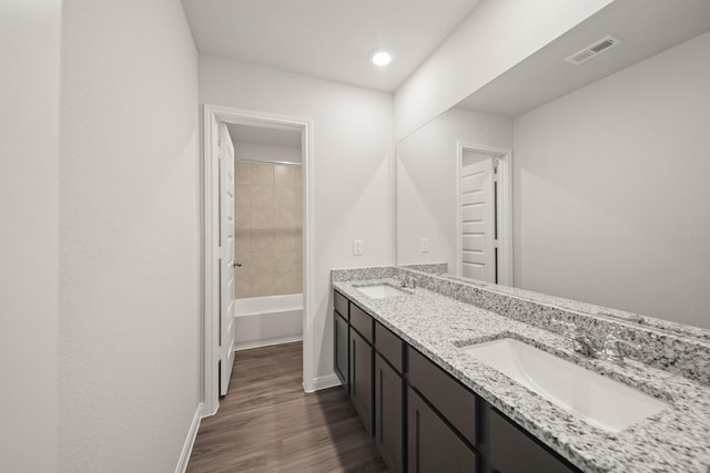13200 Musky Dr, Conroe, TX 77384 - full bath featuring double vanity, wood finished floors, and recessed lighting