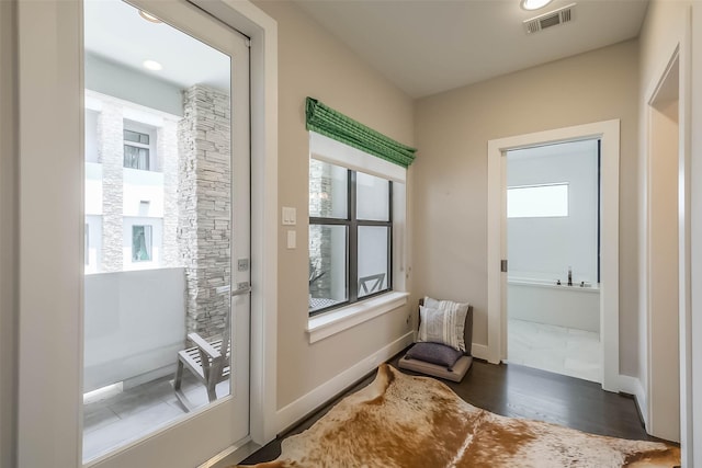 1906 Park St, Houston, TX 77019 - doorway to outside featuring wood finished floors and baseboards